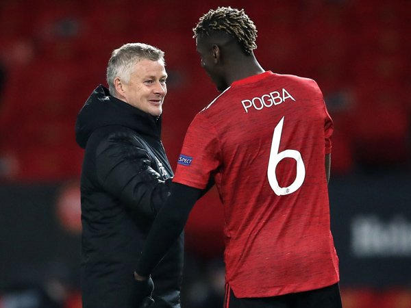 Paul Pogba dan Ole Gunnar Solskjaer.