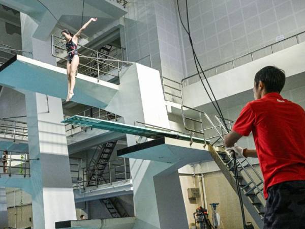 Di China, peloncat indah mulai berlatih secara profesional sejak usia lima atau enam tahun. (Foto: AFP)