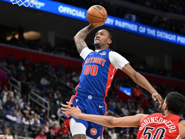 Ron Holland mencetak 26 poin saat tuan rumah Detroit Pistons mengalahkan New Orleans Pelicans, 136-130, pada Minggu (22/3) siang. (Foto: AP)