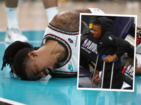 Ja Morant meringis kesakitan dan kemudian terlihat memakai kruk di Game 3 versus Thunder. (Foto: AP)