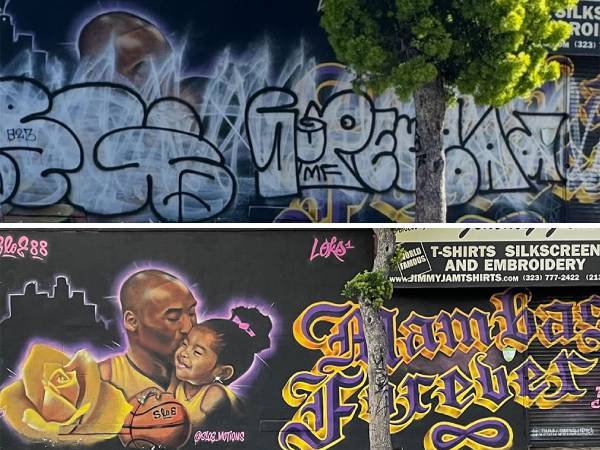 Penampakan mural yang dirusak dengan cat semprot hitam dan putih, sehingga hanya menyisakan sebagian gambar Kobe Bryant dan simbol infinity yang terlihat.