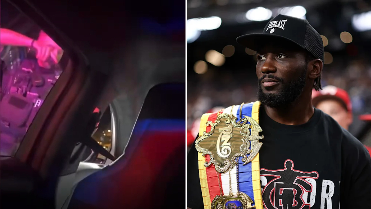 Seorang polisi (kiri) tampak menodongkan polisi ke arah Terence Crawford yang mengemudikan mobil. (Foto: AP)