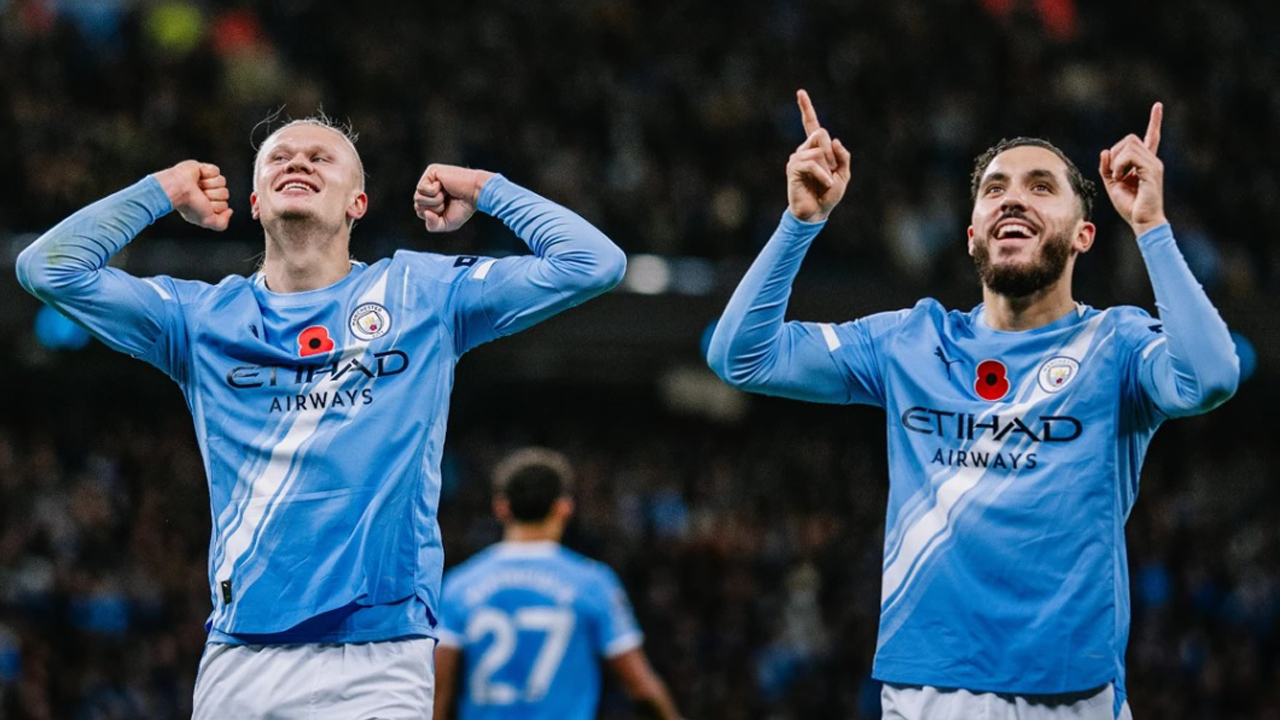 Erling Haaland dan Rayan Cherki.