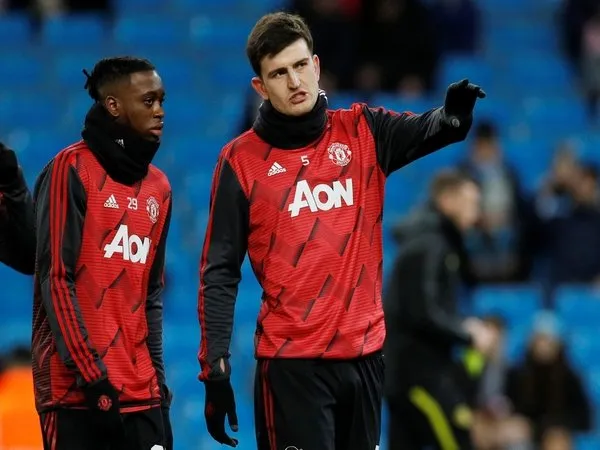 Aaron Wan-Bissaka dan Harry Maguire dilaporkan masuk dalam daftar jual MU di musim panas tahun ini / via Getty Images